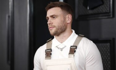 Gus Kenworthy's kiss with on-screen boyfriend was cut from "80 for Brady." Kenworthy here arrives Sunday