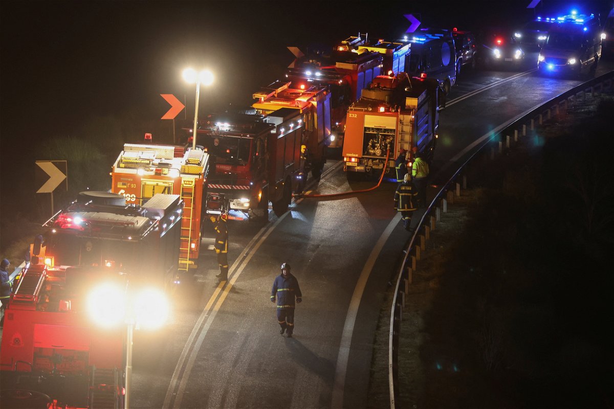 <i>Thanos Floulis/Reuters</i><br/>Firefighters attend the scene of the crash near the city of Larissa