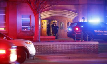 Police investigate the scene of a shooting at Berkey Hall on the campus of Michigan State University