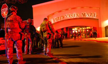 Law enforcement members gather outside the Cielo Vista Mall after a shooting