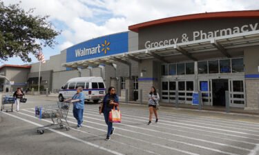 Customers exit a Walmart store on January 24