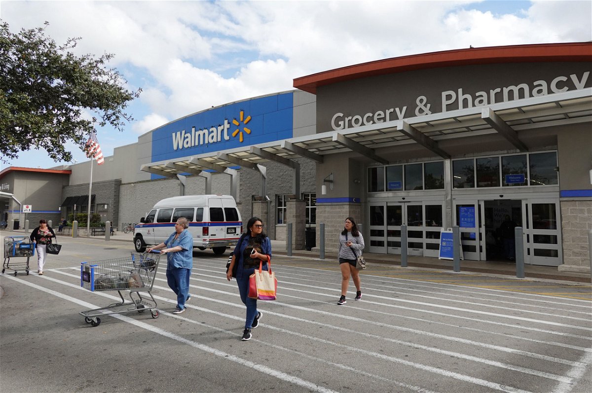 <i>Joe Raedle/Getty Images/File</i><br/>Customers exit a Walmart store on January 24