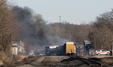 Smoke rises Saturday from a derailed cargo train in East Palestine