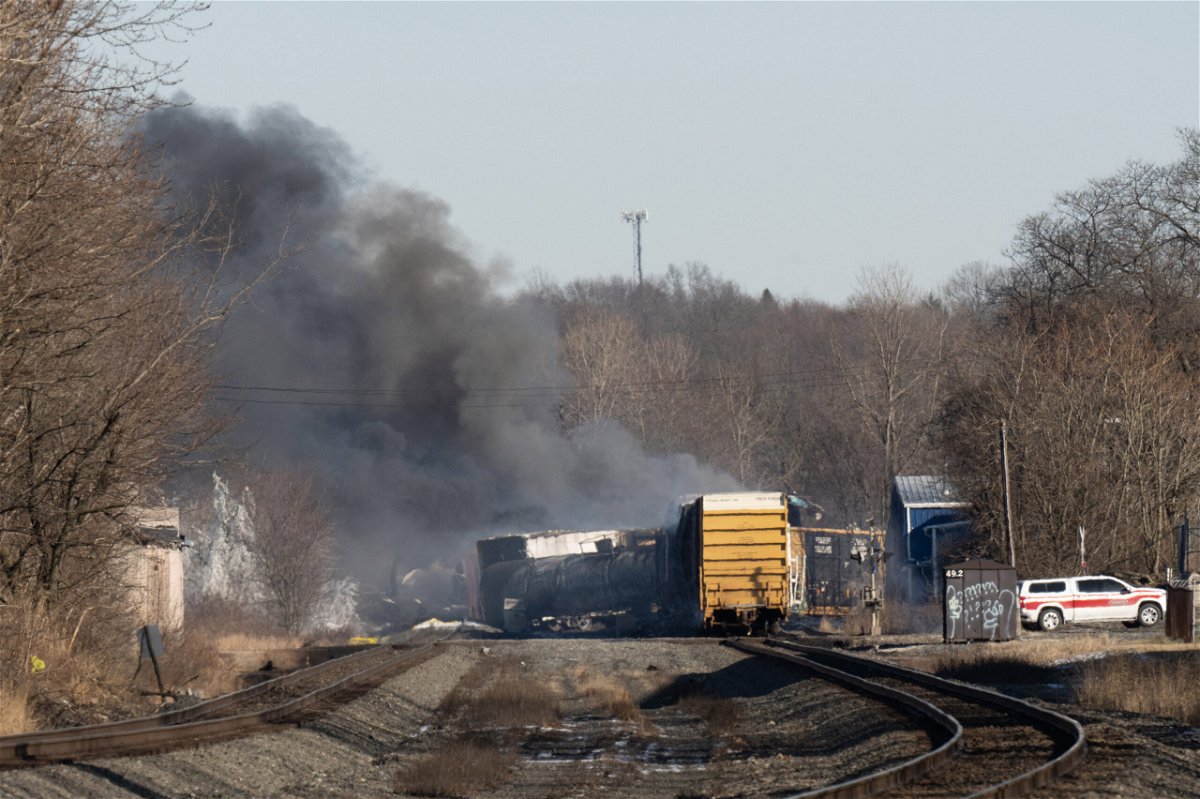 <i>Dustin Franz/AFP/Getty Images</i><br/>Smoke rises Saturday from a derailed cargo train in East Palestine
