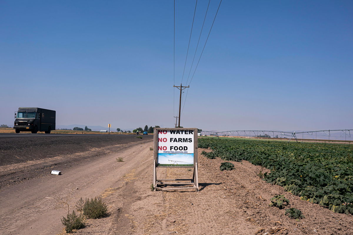 <i>Nathan Howard/AP</i><br/>Traffic passes a sign reading 