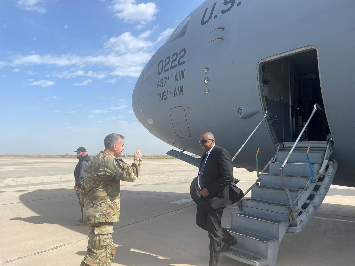 <i>Idrees Ali/Reuters</i><br/>Defense Secretary Lloyd Austin is greeted by Major General Matthew McFarlane