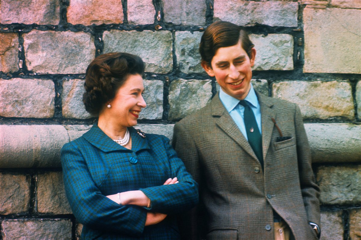 <i>Bettmann Archive/Getty Images</i><br/>Prince Charles (right) and Queen Elizabeth are seen here at their Windsor home in 1969.