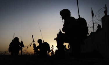 A probe into whether UK soldiers summarily executed relatives of two innocent Afghan families began Wednesday. Pictured are troops on patrol in this file photograph from Afghanistan.
