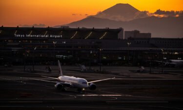 A Japan Airlines plane is pictured here with Mount Fuji in the background at Haneda Airport in Tokyo in February.