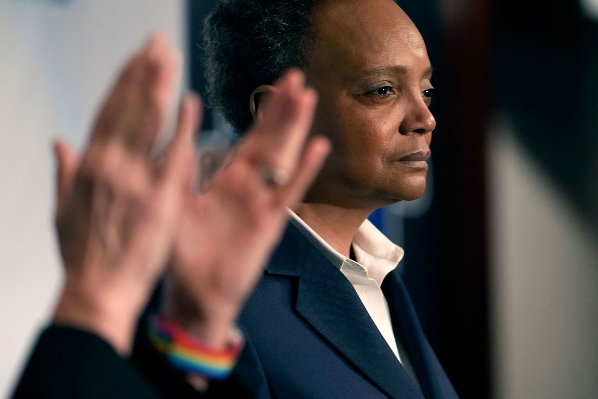 <i>Charles Rex Arbogast/AP</i><br/>Chicago Mayor Lori Lightfoot pauses during her concession speech as her spouse Amy Eshleman applauds on February 28 in Chicago.