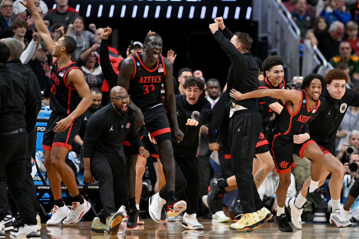 <i>Jamie Rhodes/USA Today Sports</i><br/>San Diego State Aztecs players celebrate defeating the Alabama Crimson Tide in the men's NCAA tournament third round on March 24 in Louisville