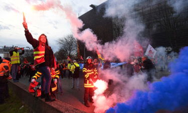 CGT unionists light flares on the ring road as they block the traffic to protest