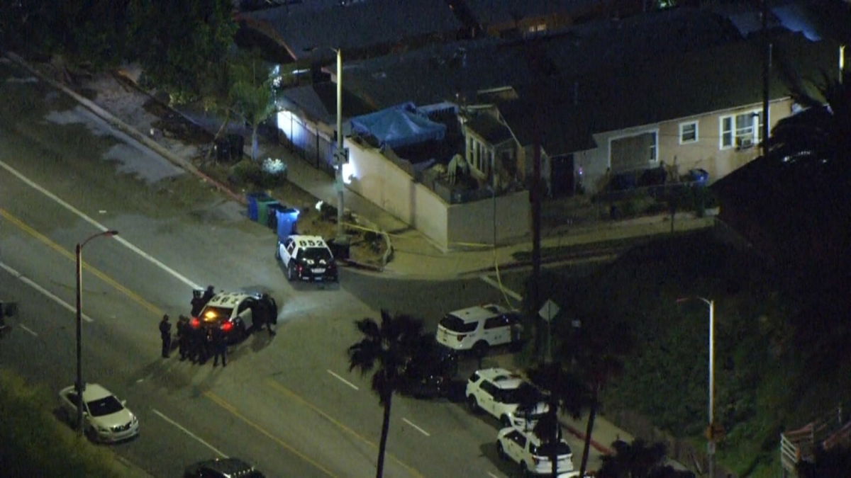 <i>KCBS/KCAL</i><br/>Police respond to the scene of a shooting that left three officers wounded in Los Angeles on March 8.