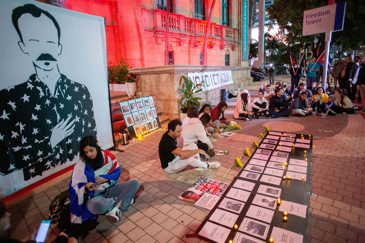 <i>Cristobal Herrera-Ulashkevich/EPA-EFE/Shutterstock</i><br/>Members of the Cuban-American community attend a vigil held for the Cuban artist and dissident Luis Manuel Otero Alcantara and for other Cubans imprisoned after protests.