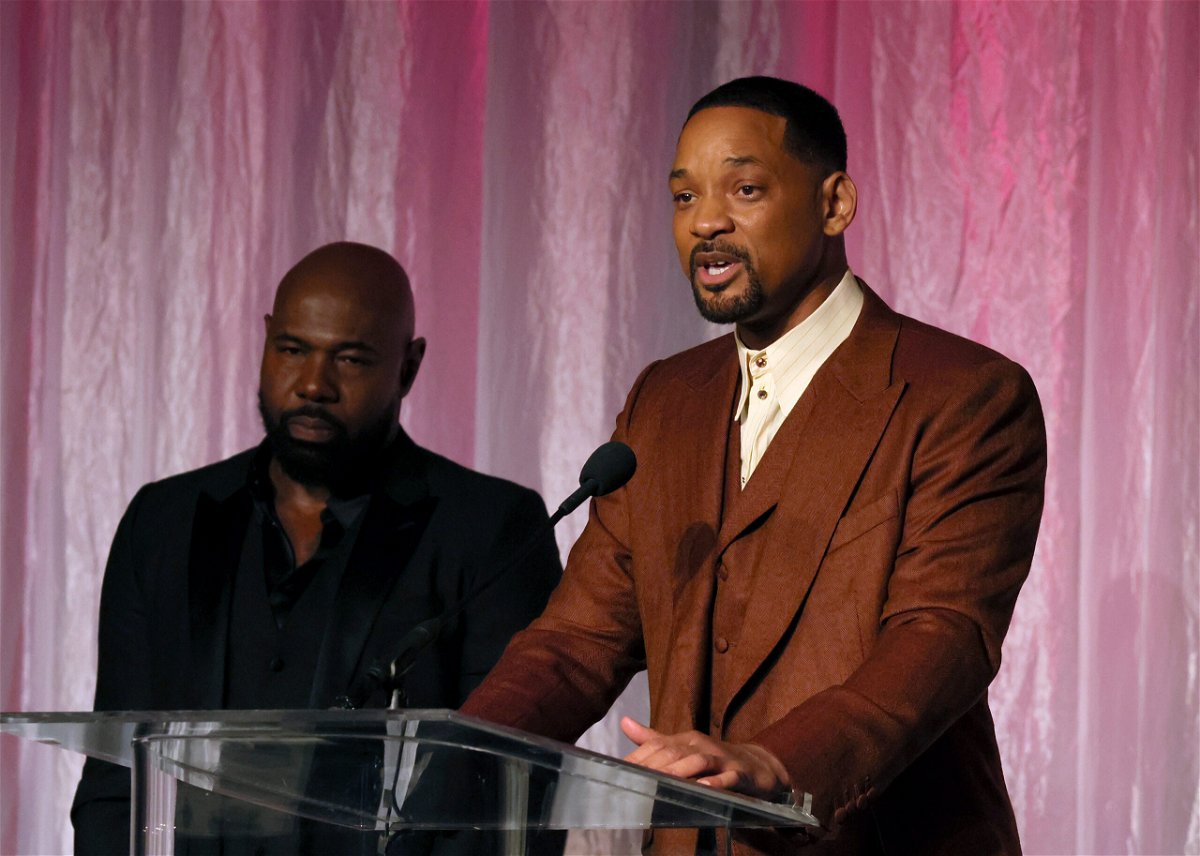 <i>Jemal Countess/Getty Images</i><br/>Honorees Antoine Fuqua (left) and Will Smith accept The Beacon Award for 