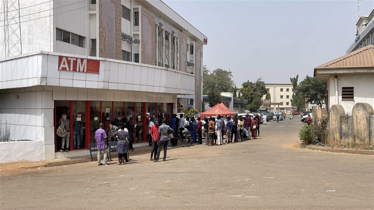<i>Nimi Princewill/CNN</i><br/>Nigerians queue for new banknotes at an ATM in the capital Abuja