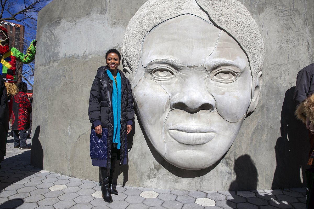 <i>Ted Shaffrey/AP</i><br/>Architect Nina Cooke John stands with the Harriet Tubman monument she designed