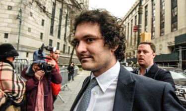 Sam Bankman-Fried arrives at federal court in New York last month. Prosecutors want Bankman-Fried to use a flip phone as part of a more restrictive bail package.