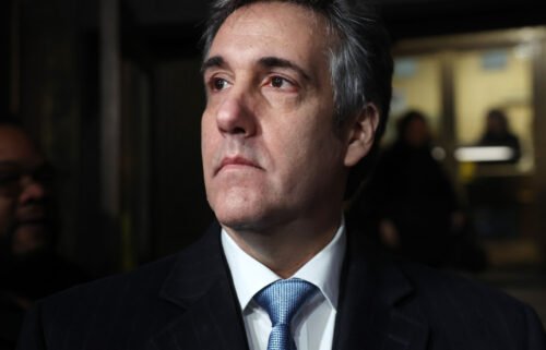 Former Donald Trump lawyer Michael Cohen walks out of a Manhattan courthouse after testifying before a grand jury on March 13