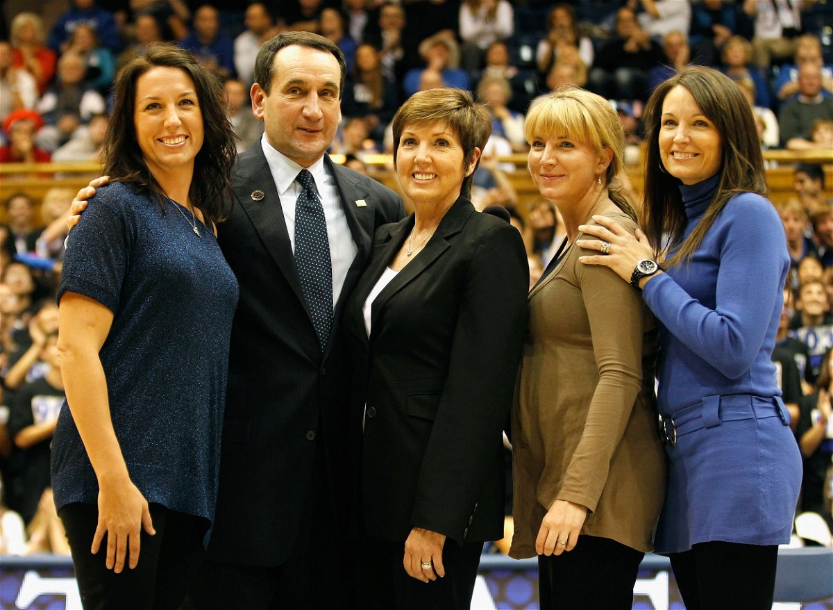 <i>Streeter Lecka/Getty Images</i><br/>Mike Krzyzewski stands with his family as he is acknowledged for breaking the record for wins in NCAA men's basketball at Cameron Indoor Stadium in November
