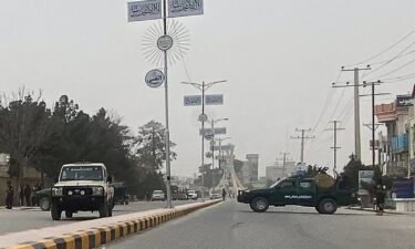 Taliban security personnel block a road in Mazar-i-Sharif