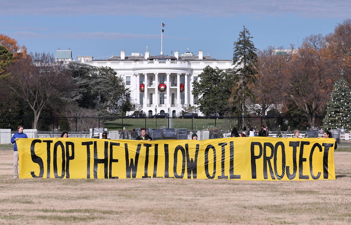 <i>Paul Morigi/Getty Images for This is Zero Hour</i><br/>Demonstrators unfurl an anti-Willow Project banner outside the White House on December 2.