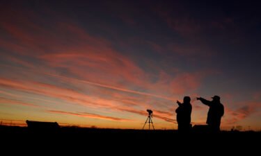 People watch the alignment of Saturn and Jupiter in December 2020 in Edgerton
