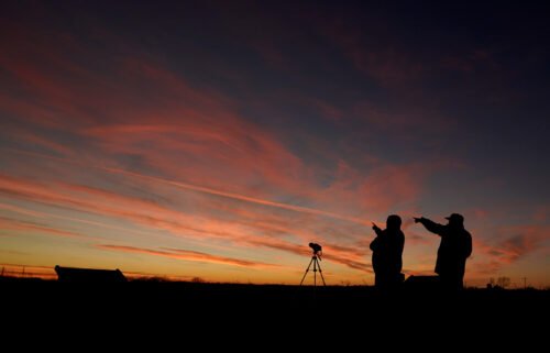 People watch the alignment of Saturn and Jupiter in December 2020 in Edgerton
