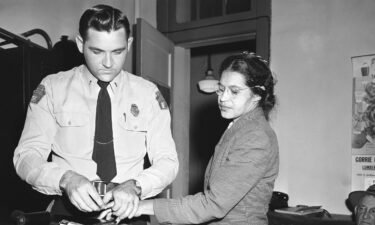 Rosa Parks (right) was fingerprinted by police Lt. D.H. Lackey in Montgomery