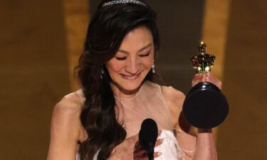 Michelle Yeoh accepts the Oscar for best actress for "Everything Everywhere All at Once" at the 95th Academy Awards in Hollywood on Sunday.