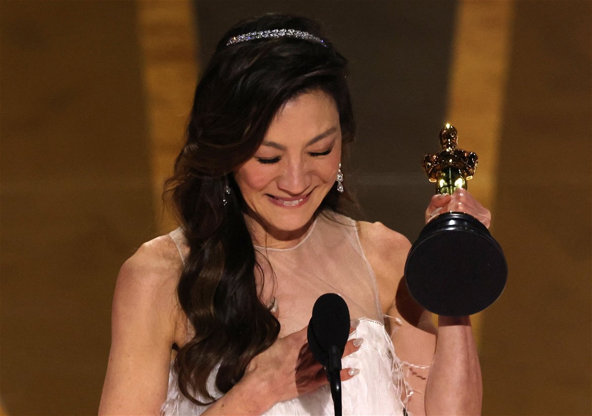 <i>Carlos Barria/Reuters</i><br/>Michelle Yeoh accepts the Oscar for best actress for 