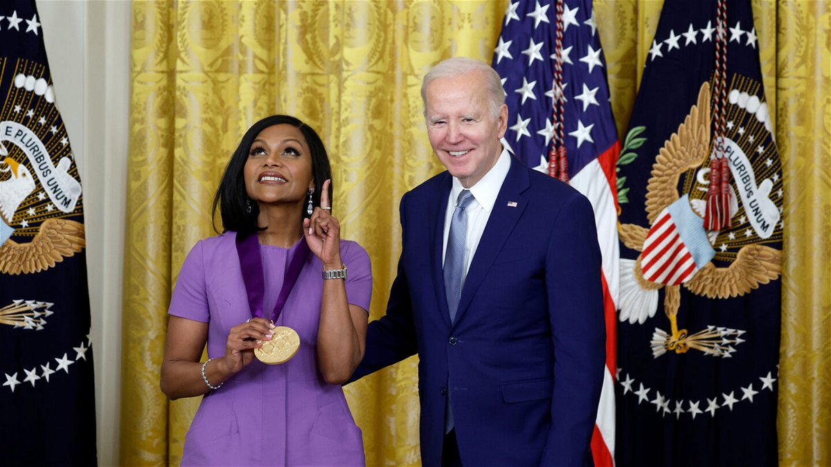 <i>Anna Moneymaker/Getty Images</i><br/>Mindy Kaling (left) received a 2021 National Medal of Arts from President Joe Biden during a ceremony in the East Room of the White House on March 21.
