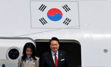 South Korea's President Yoon Suk Yeol and his wife Kim Keon-hee arrive at Tokyo International Airport in Tokyo