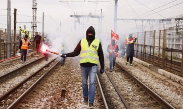 Railway workers demonstrate on the tracks at Gare de Lyon train station in Paris