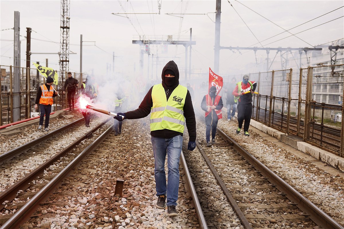 <i>Thomas Padilla/AP</i><br/>Railway workers demonstrate on the tracks at Gare de Lyon train station in Paris