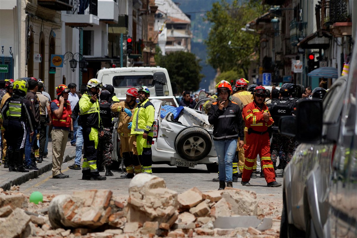<i>Rafa Idrovo Espinoza/Reuters</i><br/>A damaged car and rubble from a house affected by the earthquake are pictured in Cuenca