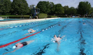 People swim at the Sommerbad Wilmersdorf public swimming pool in 2020 in Berlin
