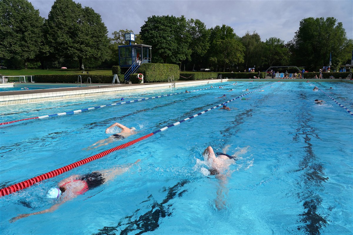 <i>Sean Gallup/Getty Images</i><br/>People swim at the Sommerbad Wilmersdorf public swimming pool in 2020 in Berlin