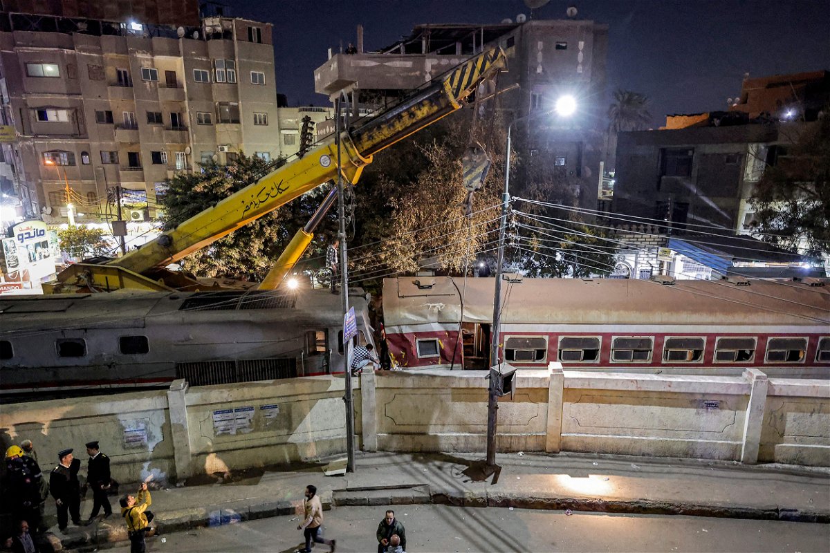 <i>Khaled Desouki/AFP/Getty Images</i><br/>A crane is deployed to lift a derailed train at the scene of a railroad accident in the city of Qalyub in Qalyub province