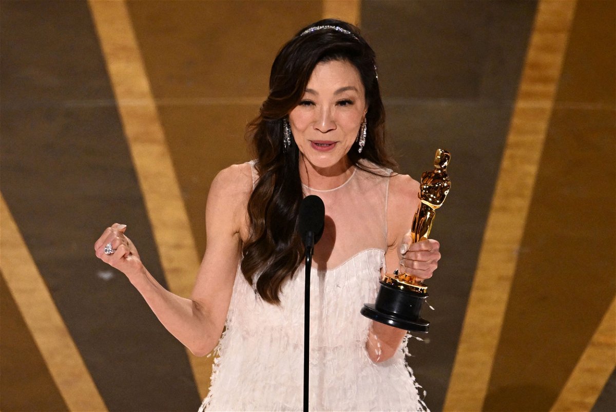 <i>Patrick T. Fallon/AFP/Getty Images</i><br/>Michelle Yeoh accepts the Oscar for best actress for 'Everything Everywhere All at Once' on March 12.