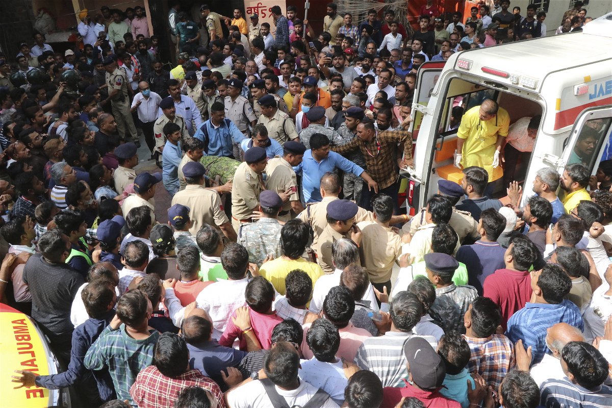 <i>AP</i><br/>A victim is carried to an ambulance in Indore