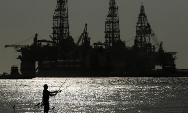 The Biden administration is auctioning off more than 73 million acres of waters in the Gulf of Mexico to offshore oil and gas drilling. Pictured is an oil drilling platform in Port Aransas