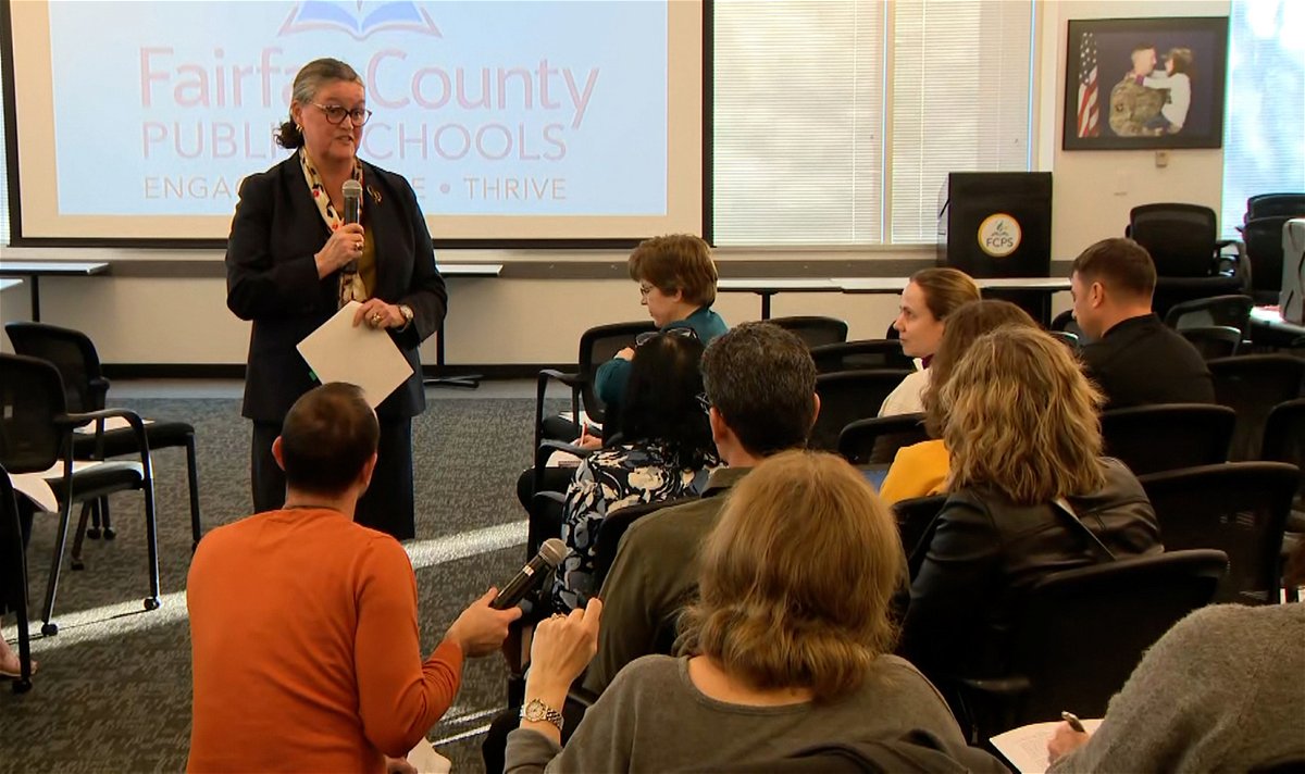 <i>CNN</i><br/>Fairfax County Public Schools superintendent Michelle Reid (top left) speaks at a meeting on Wednesday.