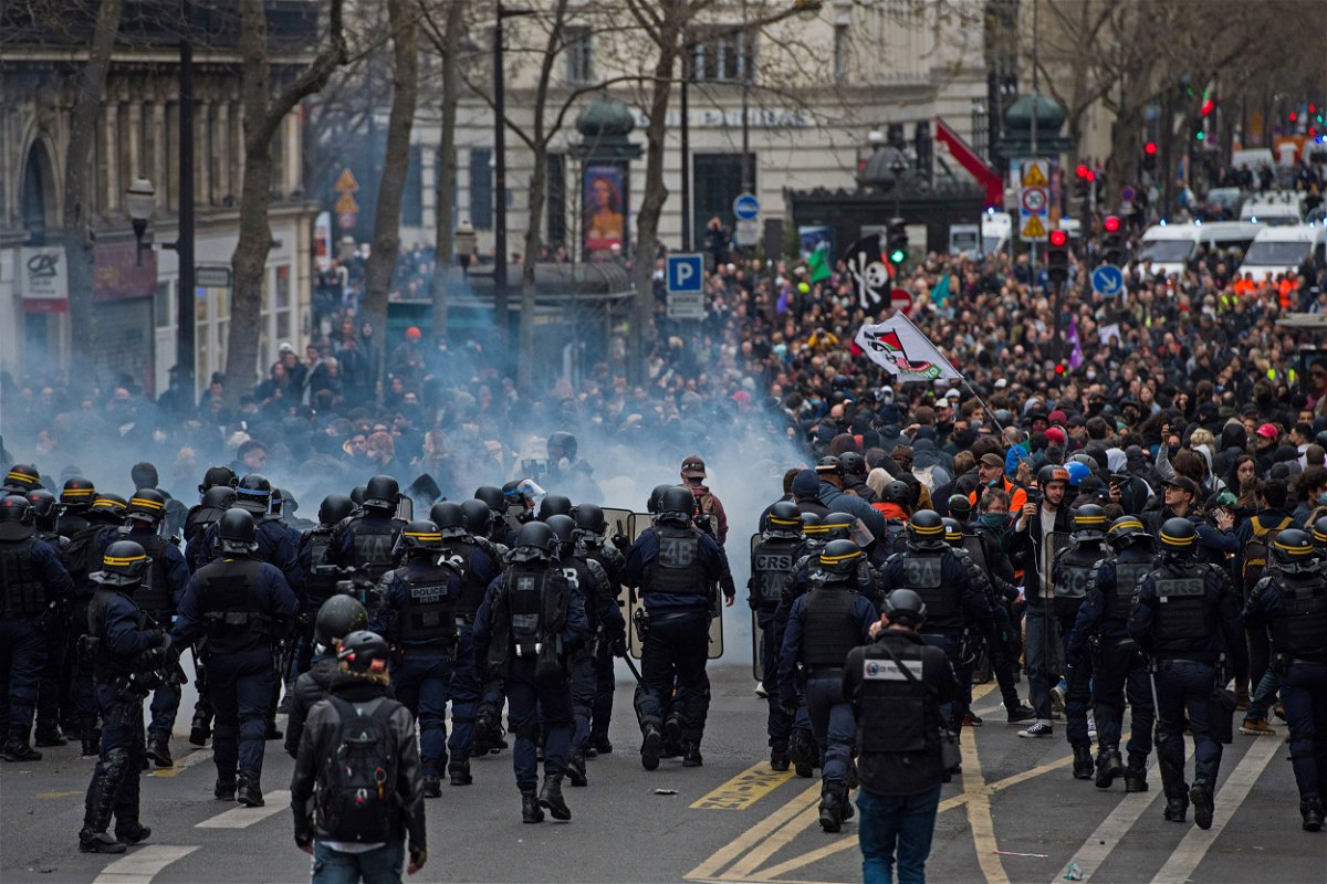 <i>Nathan Laine/Bloomberg/Getty Images</i><br/>Riot police face protesters during a demonstration as part of a nationwide strike against pension reform in central Paris on Thursday.