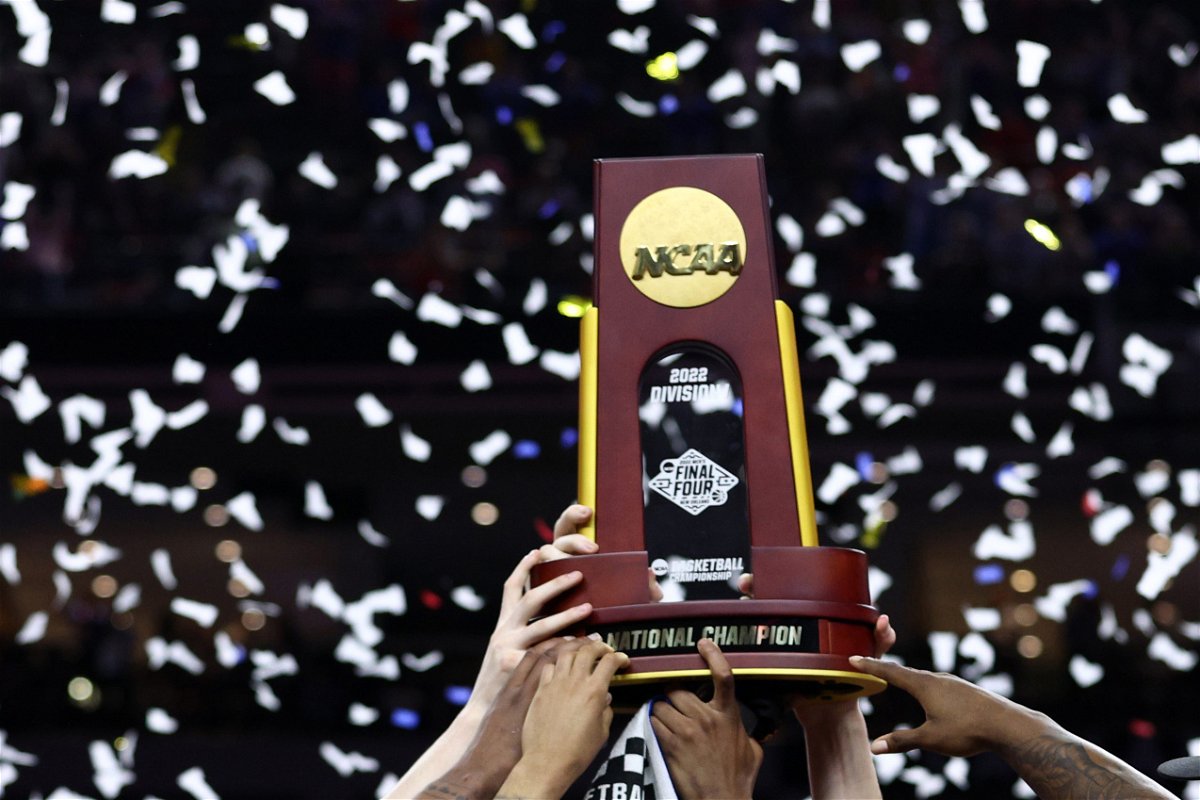 <i>Tom Pennington/Getty Images</i><br/>The Kansas Jayhawks celebrate with the trophy after defeating the North Carolina Tar Heels during the 2022 NCAA Men's Basketball Tournament National Championship at Caesars Superdome in 2022.