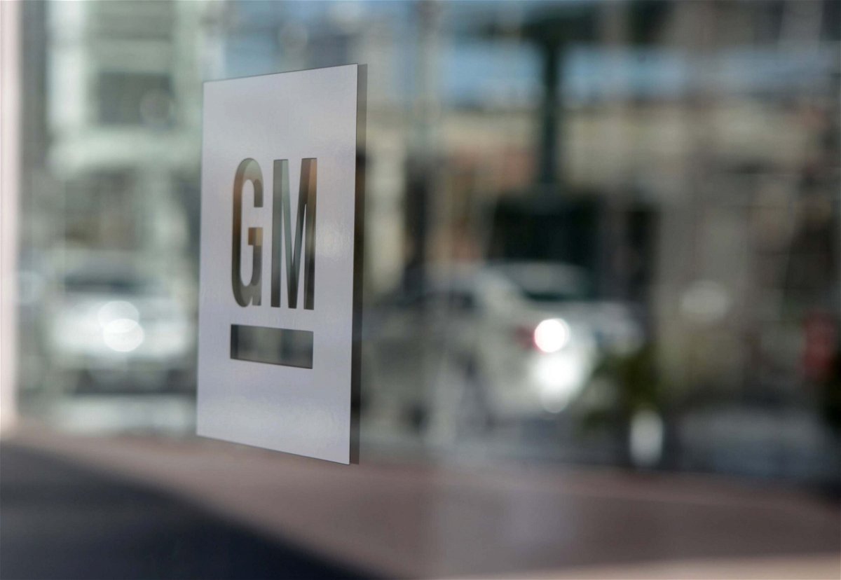 <i>Jeff Kowalsky/Bloomberg/Getty Images</i><br/>General Motors is cutting hundreds of white collar jobs to remain competitive in the shift to electric vehicles. GM signage is displayed outside the company's headquarters in Detroit