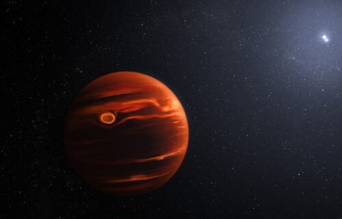 An illustration of exoplanet VHS 1256 b and its two stars.