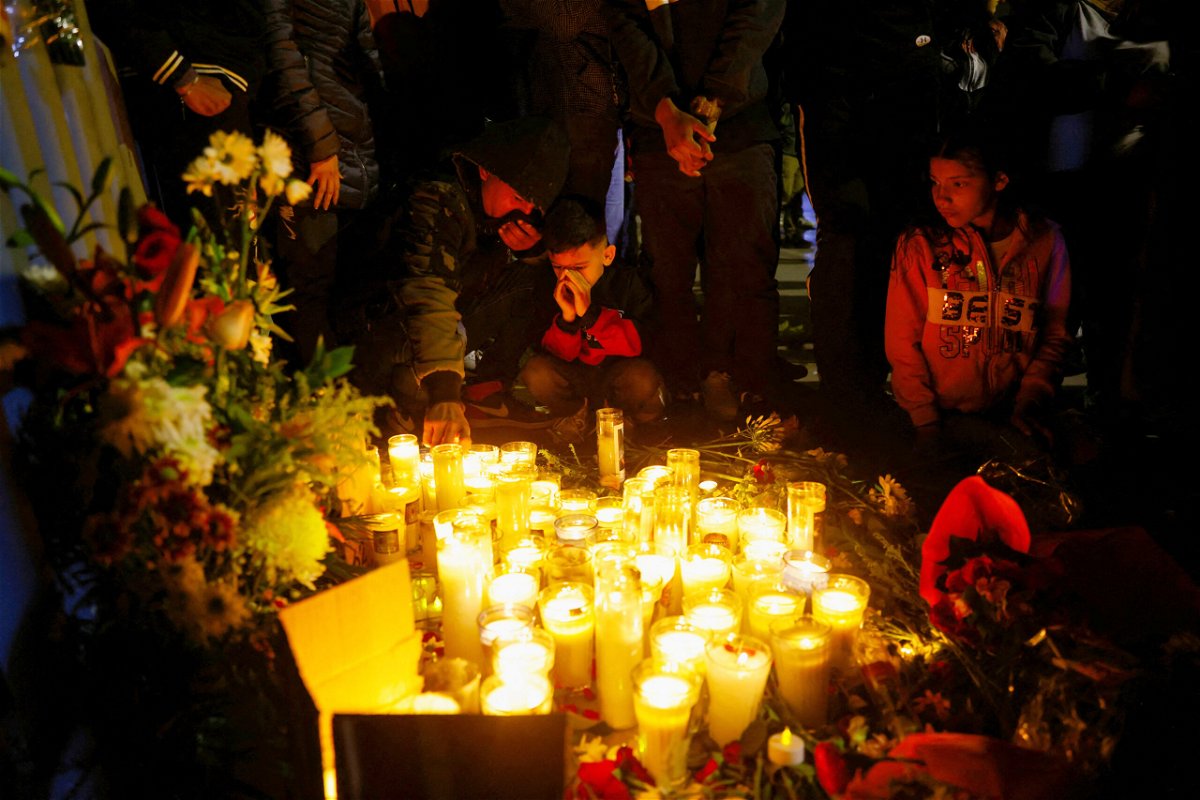 <i>Jose Luis Gonzalez/Reuters</i><br/>A candle vigil for the victims of the migrant detention center fire.
