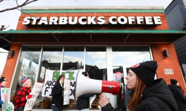 Starbucks workers attend a rally as they go on a one-day strike outside a store in Buffalo
