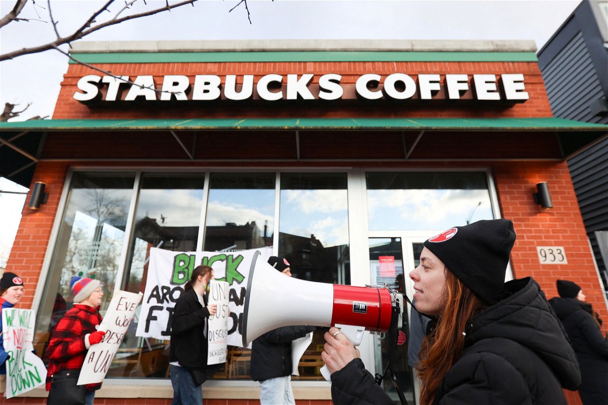 <i>Lindsay DeDario/Reuters/File</i><br/>Starbucks workers attend a rally as they go on a one-day strike outside a store in Buffalo